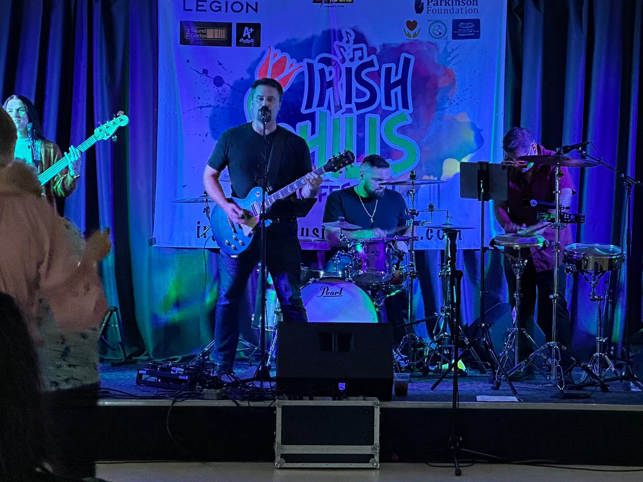 517 Rocks performing indoors under blue stage lights