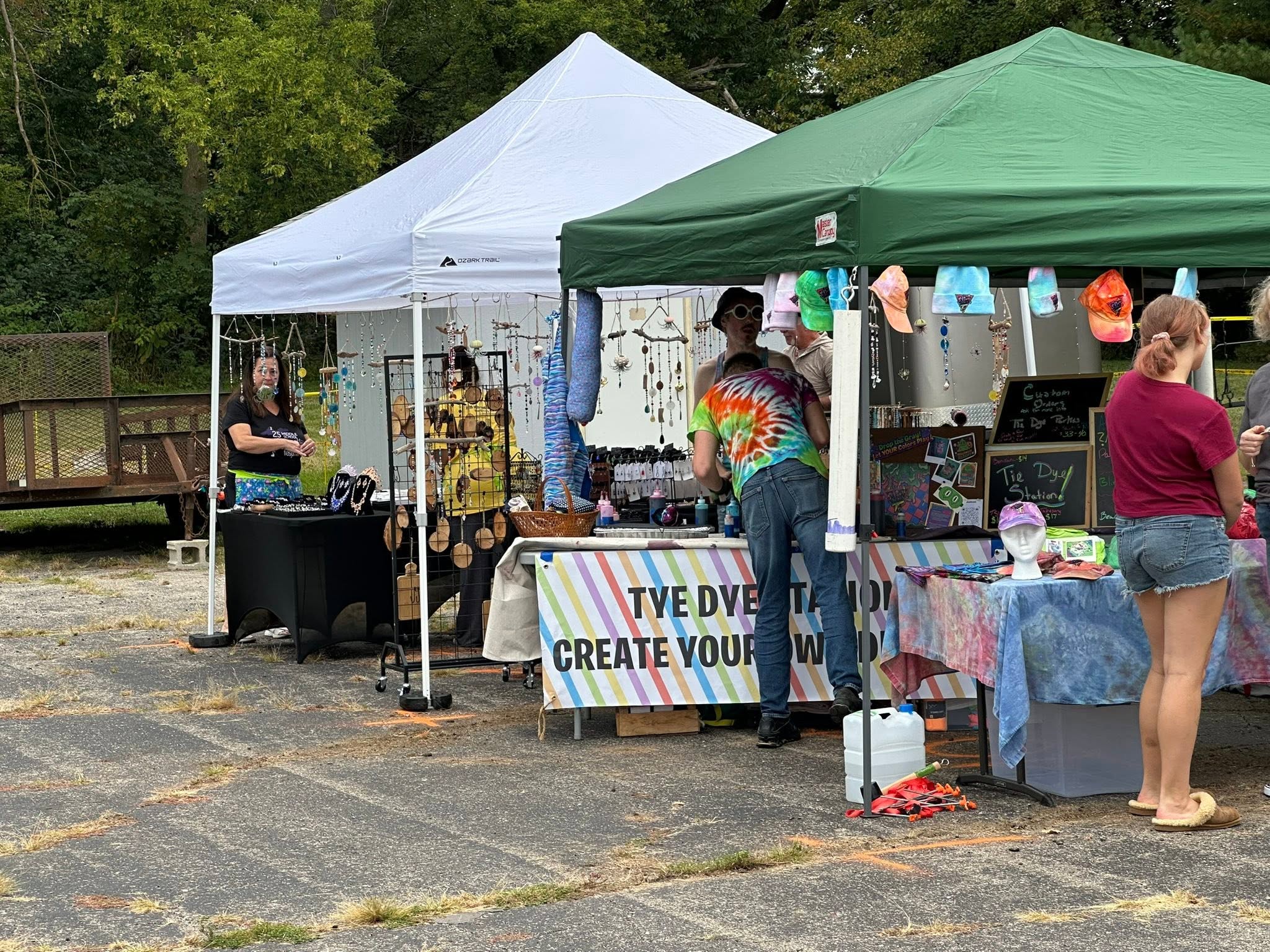 Vendor tents at the festival including a tie-dye station