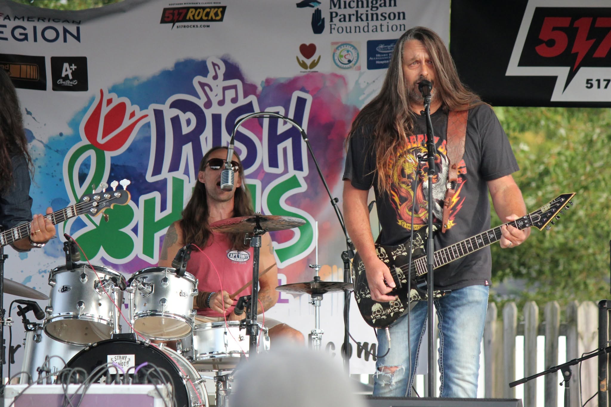 Stray Shot band performing with skull-patterned guitar